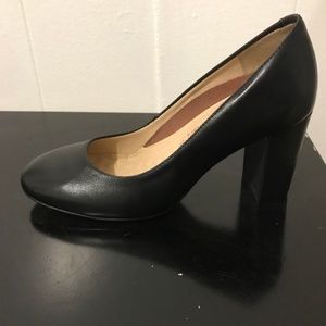 Black leather pumps